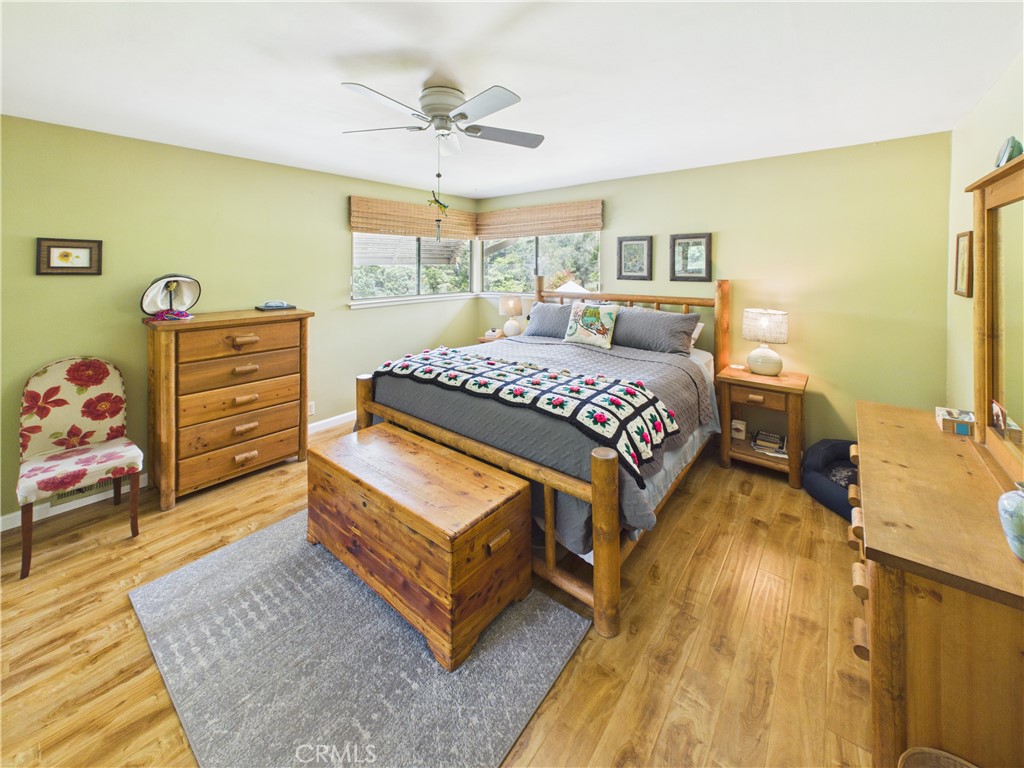 6650 Feliciana Mountain Road Midpines, CA 95345 - Photo 15 of 57 a bedroom with a bed and wooden floor