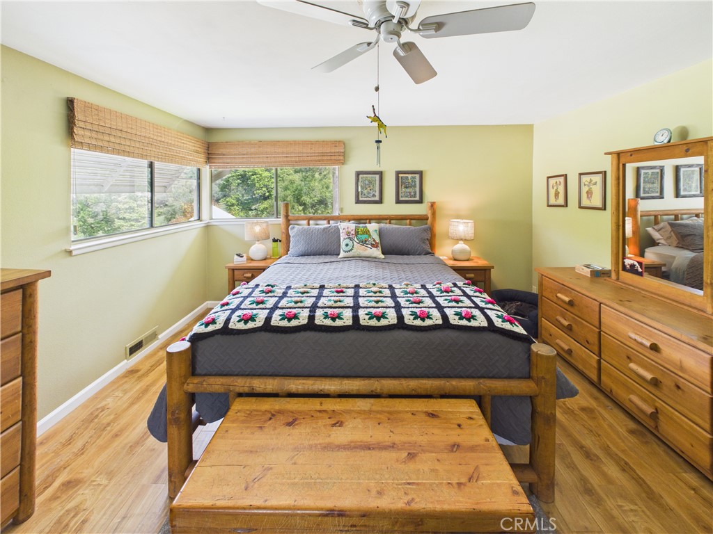 6650 Feliciana Mountain Road Midpines, CA 95345 - Photo 17 of 57 a bedroom with a large bed and a window