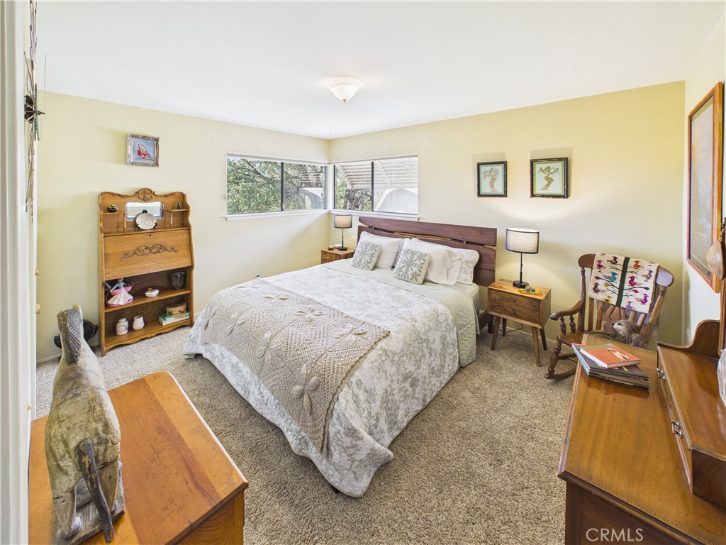 6650 Feliciana Mountain Road Midpines, CA 95345 - Photo 21 of 57 a bedroom with a bed and wooden floor