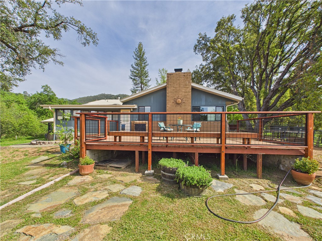 6650 Feliciana Mountain Road Midpines, CA 95345 - Photo 29 of 57 a view of a house with pool plants and large tree