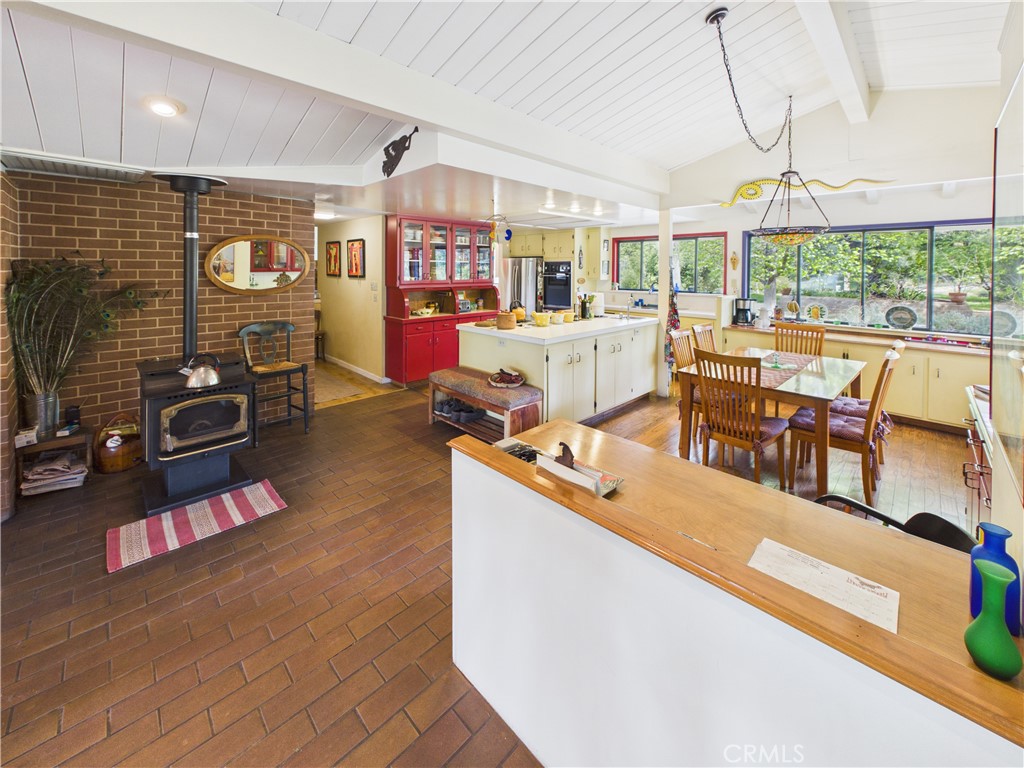 6650 Feliciana Mountain Road Midpines, CA 95345 - Photo 35 of 57 a living room with furniture a flat screen tv and a floor to ceiling window