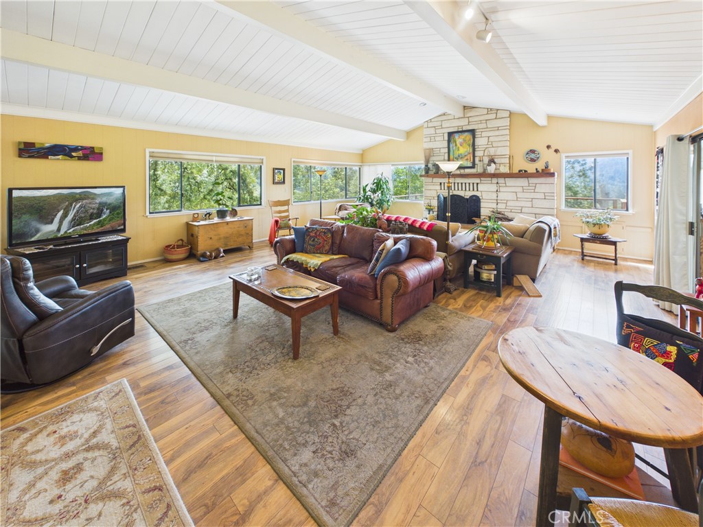 6650 Feliciana Mountain Road Midpines, CA 95345 - Photo 6 of 57 a living room with furniture fireplace and a large window