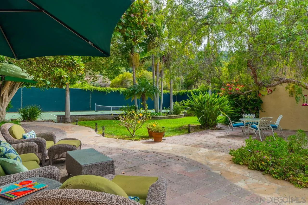 2626 Hidden Valley Road La Jolla, CA 92037 - Photo 11 of 54 a view of backyard with swimming pool and outdoor seating