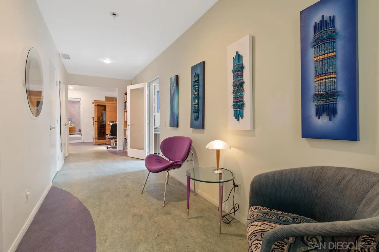 2626 Hidden Valley Road La Jolla, CA 92037 - Photo 15 of 54 a living room with furniture and a large window
