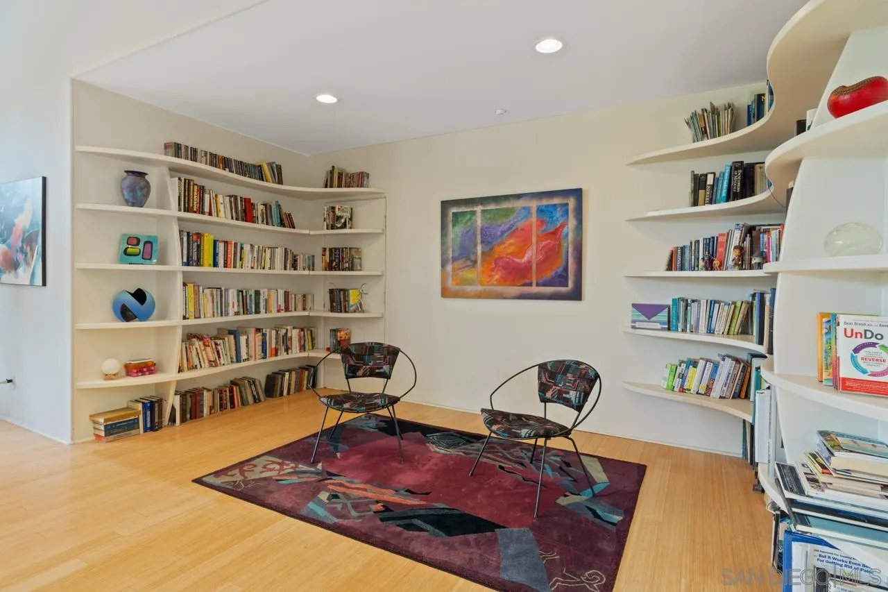 2626 Hidden Valley Road La Jolla, CA 92037 - Photo 26 of 54 a view of a workspace with bookshelf
