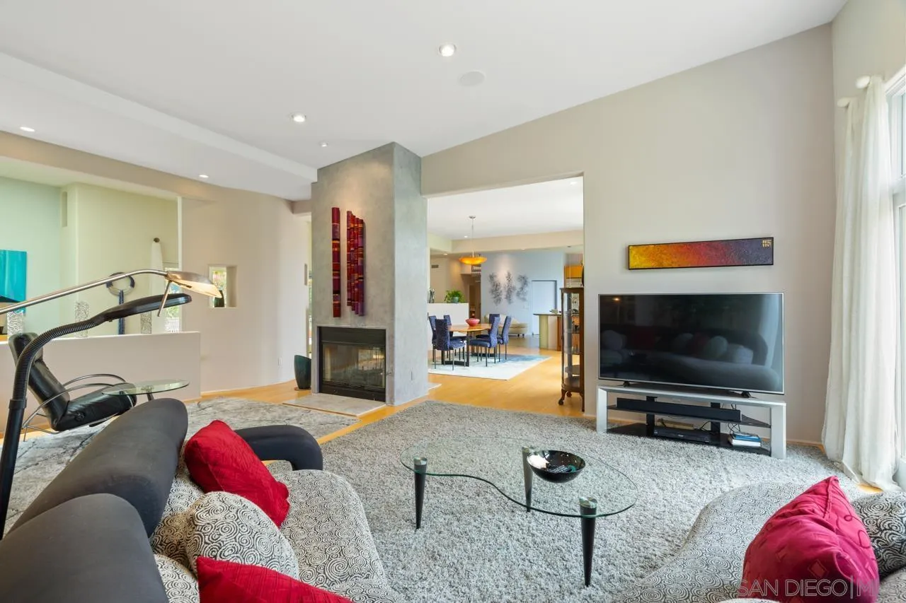 2626 Hidden Valley Road La Jolla, CA 92037 - Photo 27 of 54 a living room with furniture and a flat screen tv