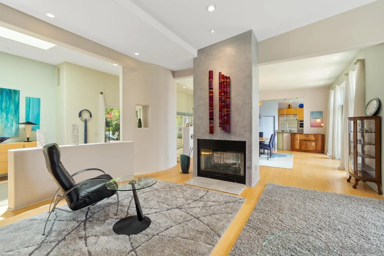 2626 Hidden Valley Road La Jolla, CA 92037 - Photo 28 of 54 a living room with furniture and a fireplace