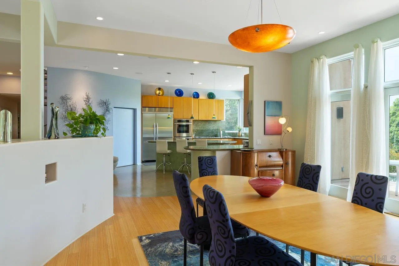 2626 Hidden Valley Road La Jolla, CA 92037 - Photo 30 of 54 a view of a dining room with furniture and wooden floor