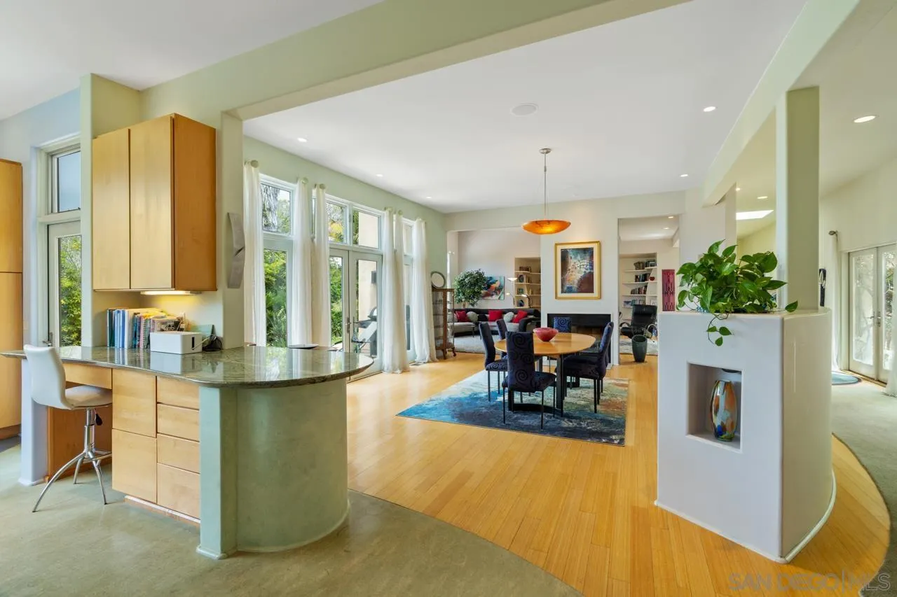 2626 Hidden Valley Road La Jolla, CA 92037 - Photo 33 of 54 a living room filled with furniture and a chandelier
