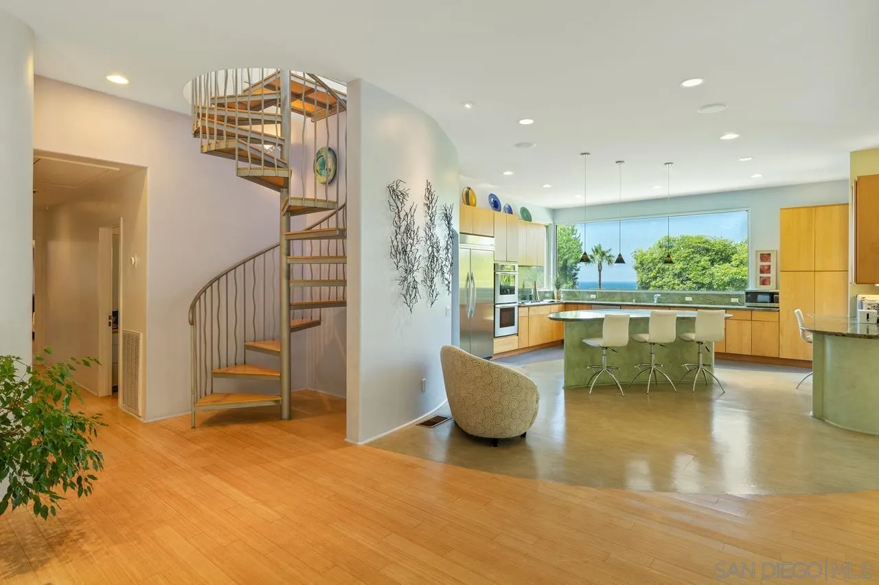 2626 Hidden Valley Road La Jolla, CA 92037 - Photo 41 of 54 a view of a living room and chandelier