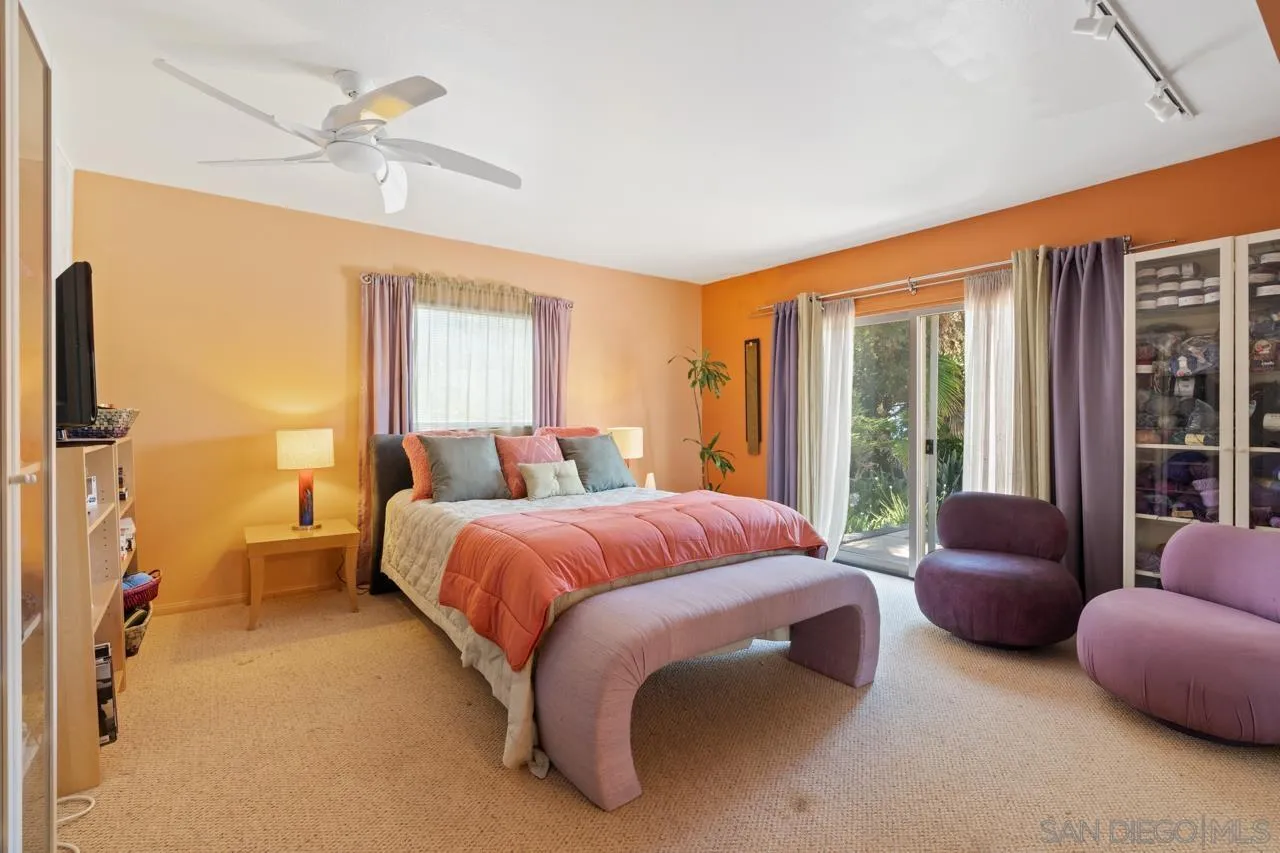 2626 Hidden Valley Road La Jolla, CA 92037 - Photo 44 of 54 a spacious bedroom with a bed and a couch
