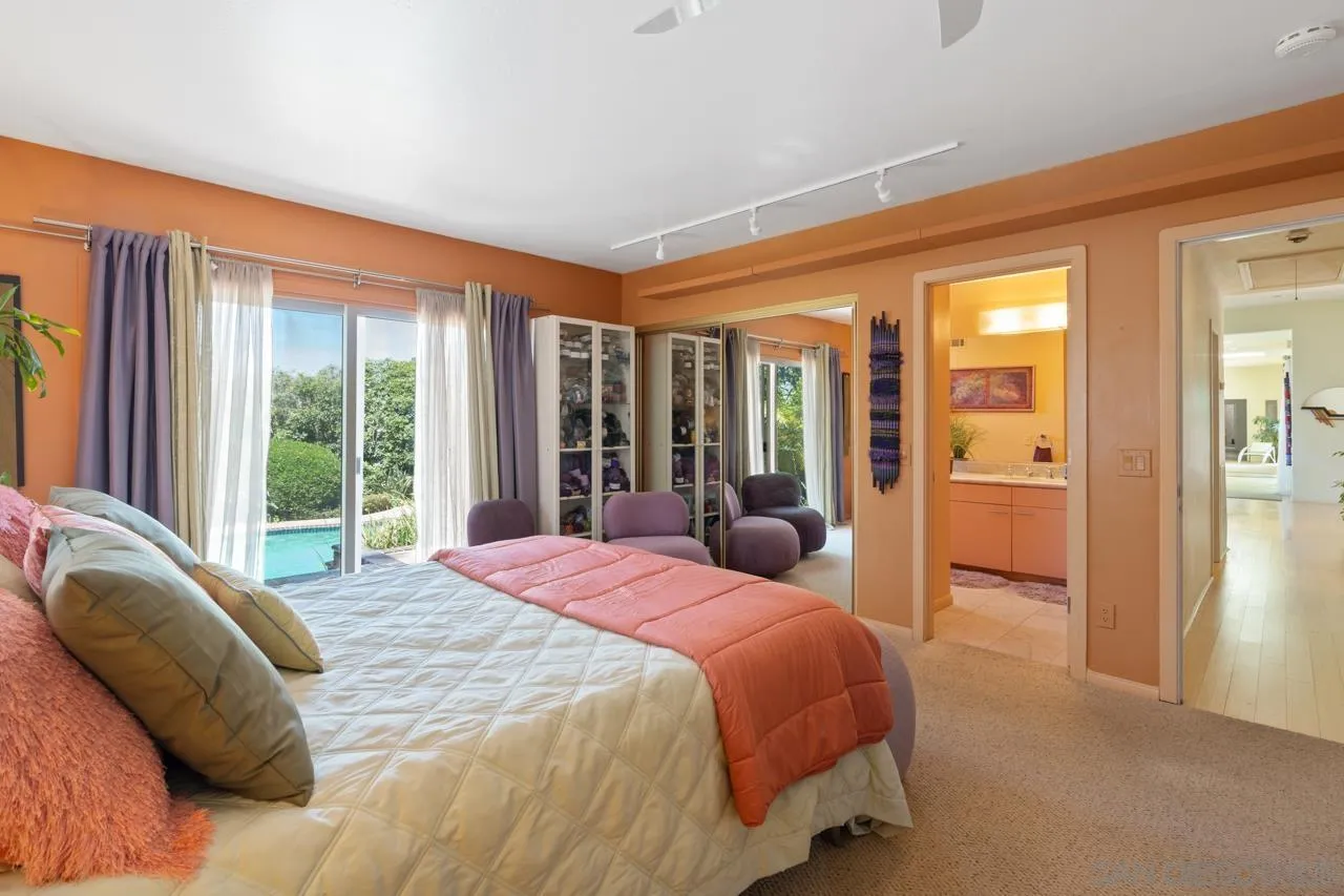 2626 Hidden Valley Road La Jolla, CA 92037 - Photo 45 of 54 a bedroom with a large bed and a large window