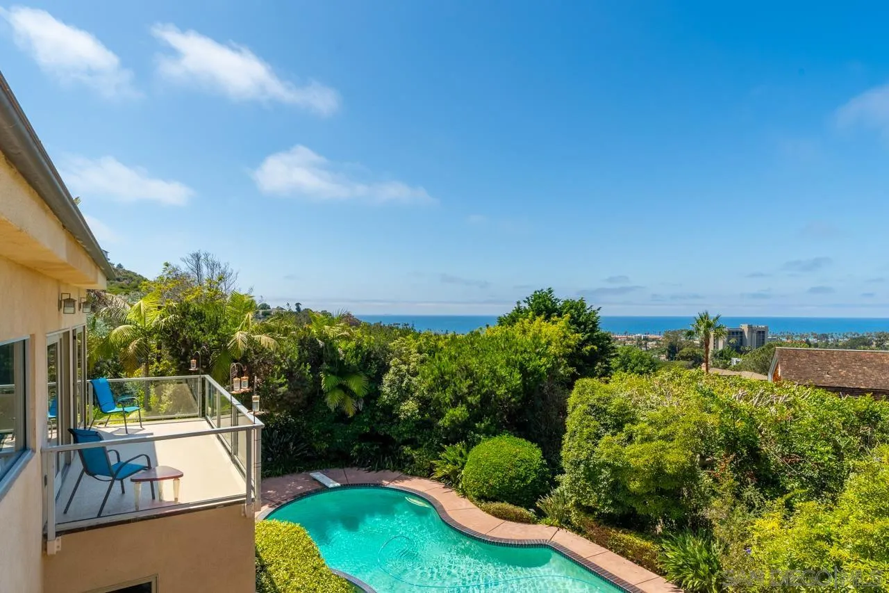 2626 Hidden Valley Road La Jolla, CA 92037 - Photo 51 of 54 a view of a swimming pool with a patio