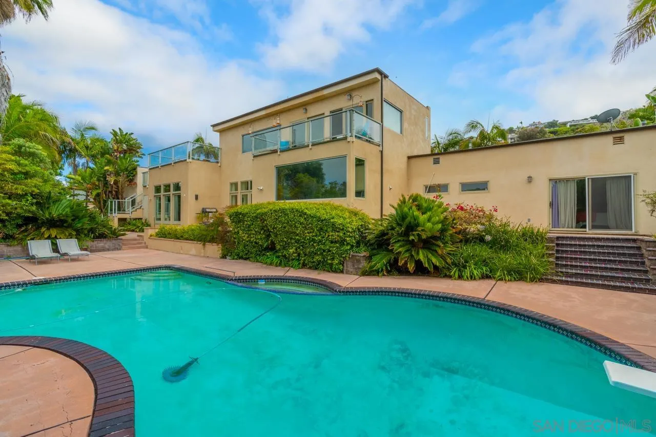 2626 Hidden Valley Road La Jolla, CA 92037 - Photo 52 of 54 a front view of a house with a yard