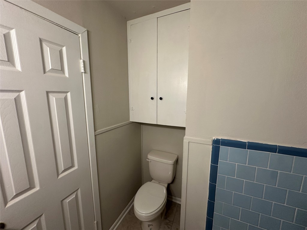 2721 Napoleon Street Houston, TX 77004 - Photo 18 of 19 a white toilet sitting next to a shower