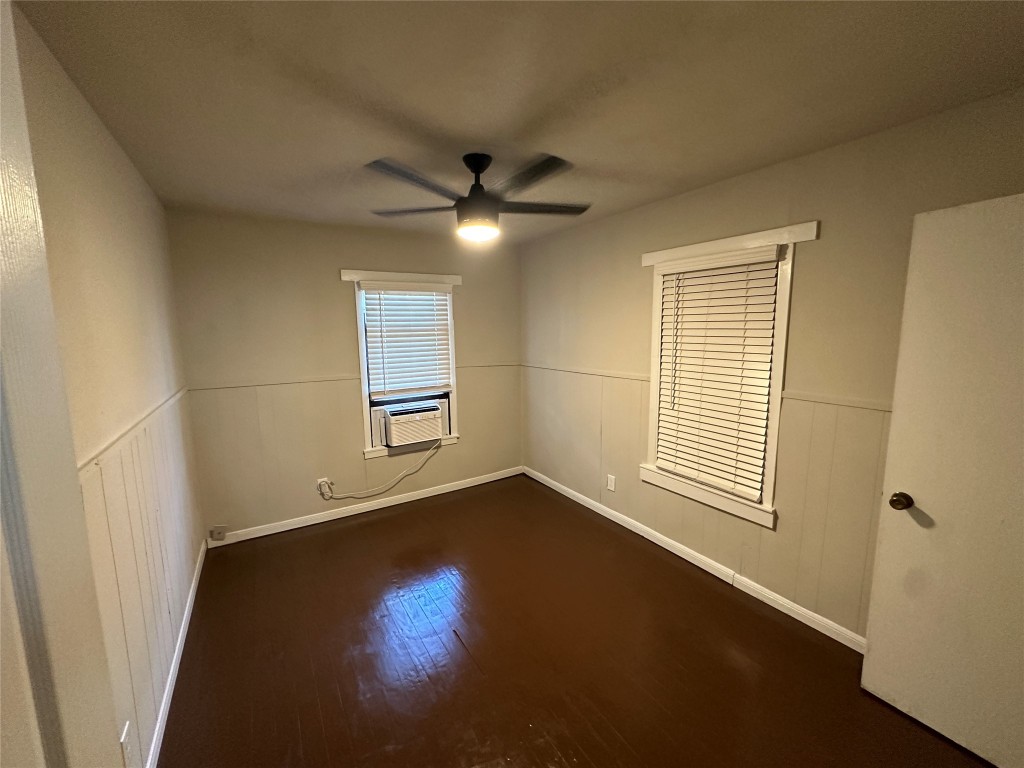2721 Napoleon Street Houston, TX 77004 - Photo 4 of 19 an empty room with wooden floor fan and windows