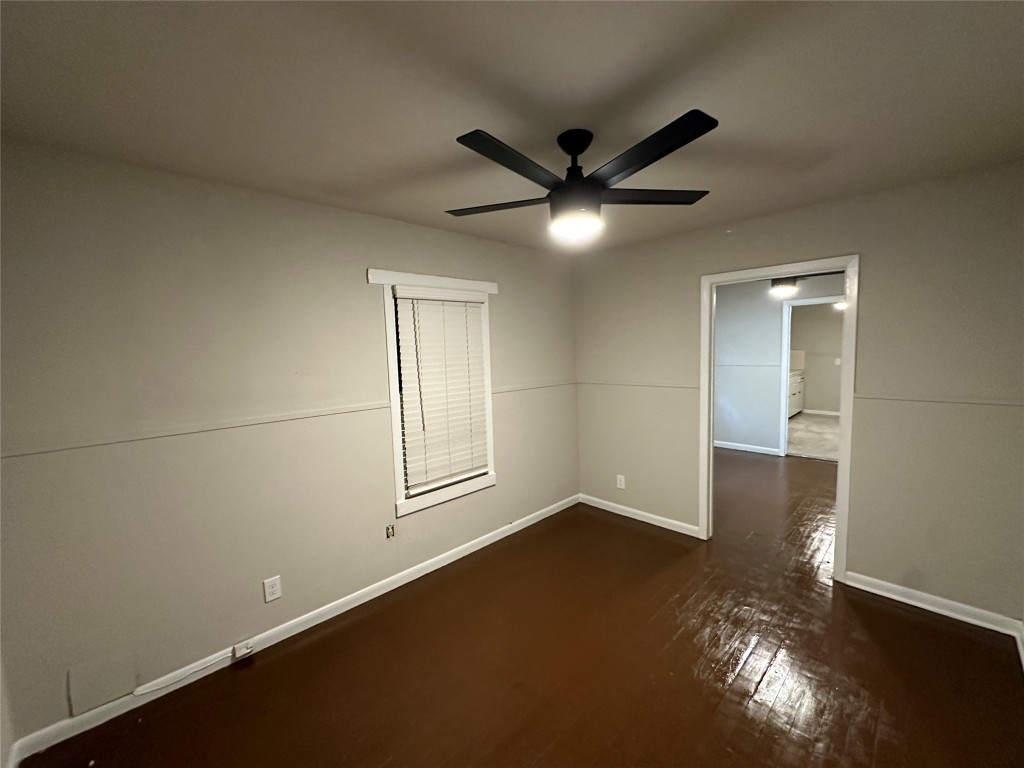 2721 Napoleon Street Houston, TX 77004 - Photo 10 of 19 wooden floor in an empty room with a window