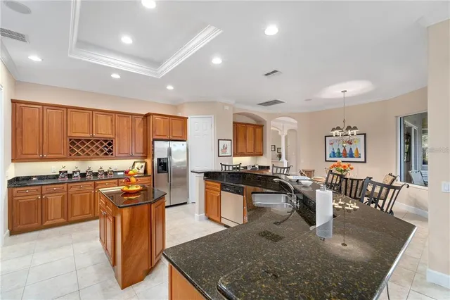 a bathroom with a tub a sink and a window