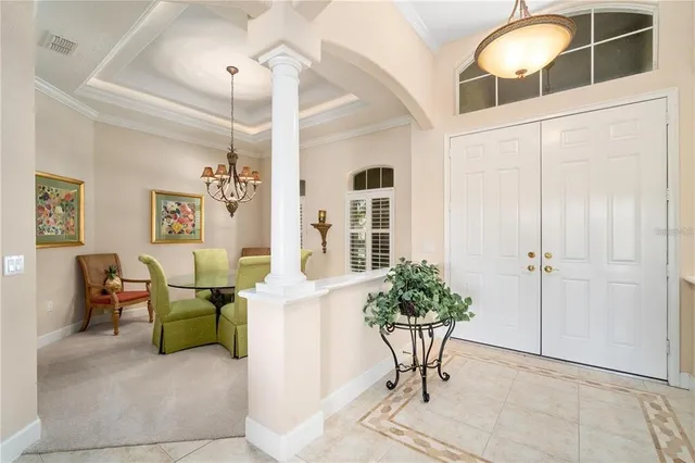 a living room with furniture a ceiling fan and a window