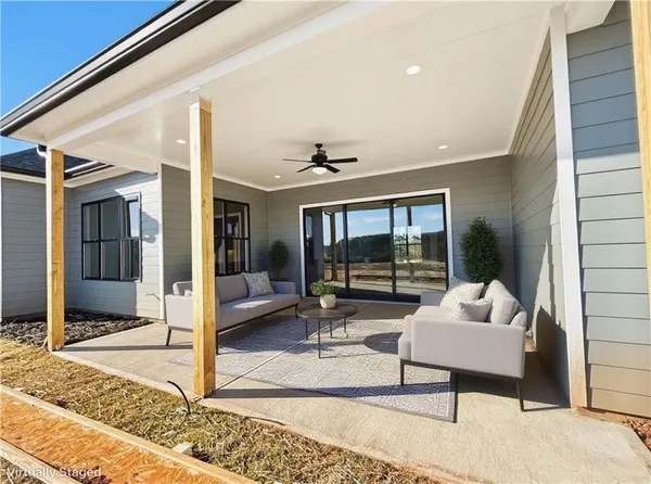 a view of kitchen with stainless steel appliances granite countertop a sink a oven and a wooden floors