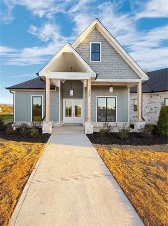 a kitchen with kitchen island a sink appliances and a wooden floor