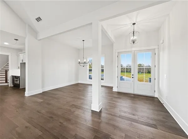 a bathroom with a double sink shower and a mirror