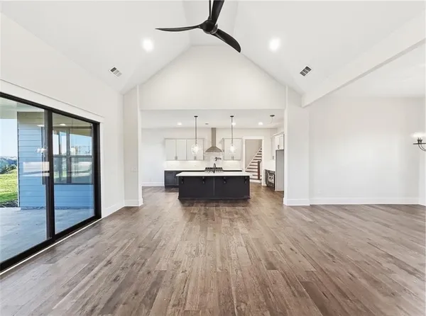 a view of staircase with wooden floor and stairs