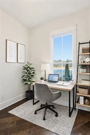 a view of a hallway view with wooden floor and staircase