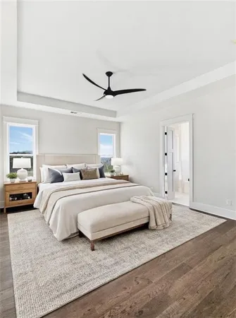 a view of empty room with wooden floor and fireplace