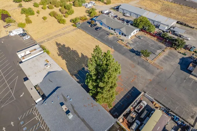 an aerial view of residential houses with outdoor space
