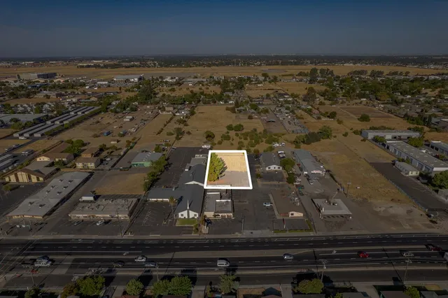 an aerial view of residential houses with outdoor space