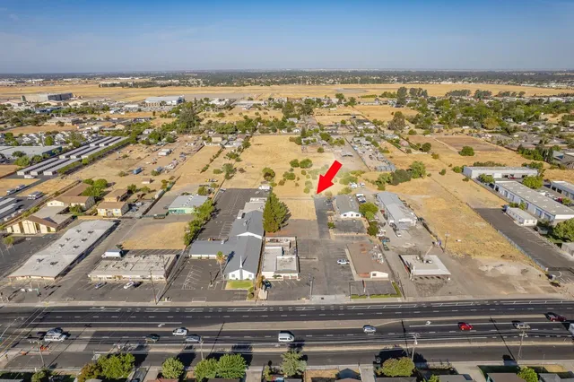 an aerial view of residential building and parking space