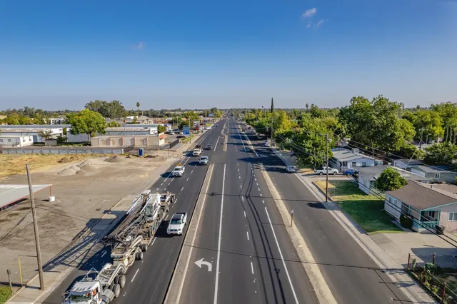an aerial view of residential houses with outdoor space