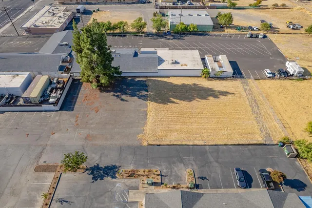 an aerial view of residential house with parking space