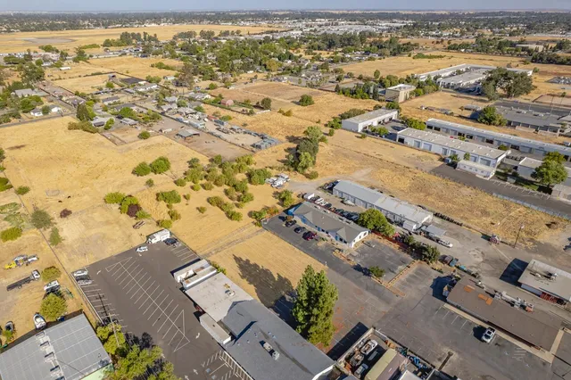 an aerial view of residential houses with outdoor space