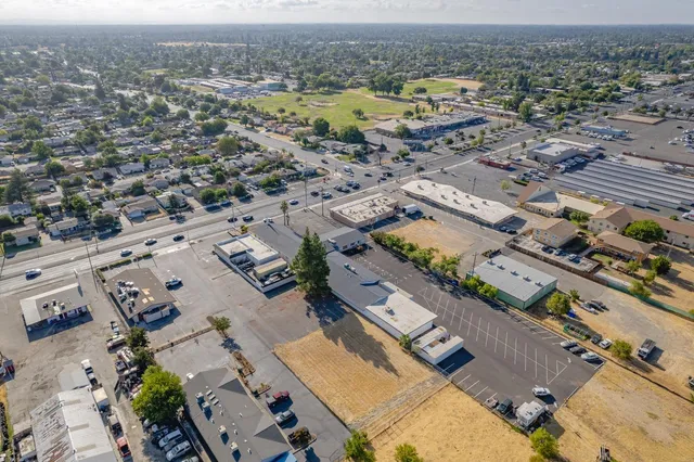an aerial view of residential houses with outdoor space