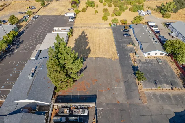 an aerial view of a house with a yard