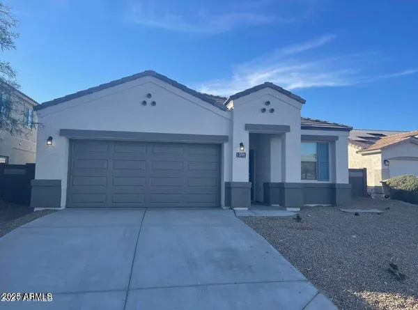 a front view of a house with a space and garage