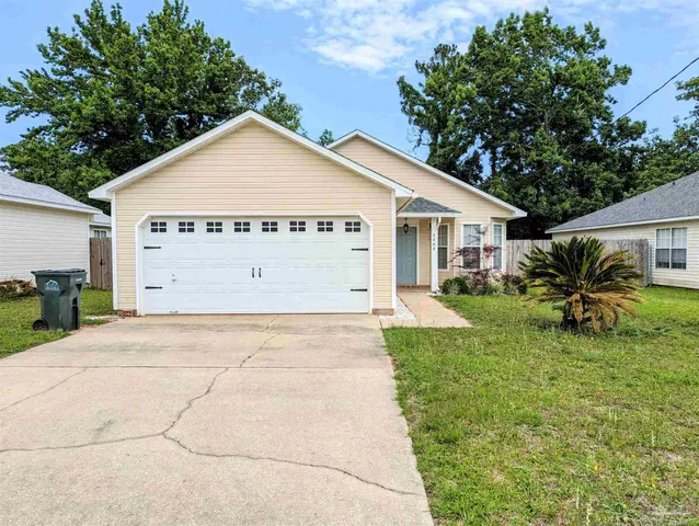 a view of garage and yard