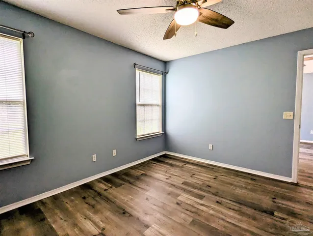 a view of room with window and ceiling fan