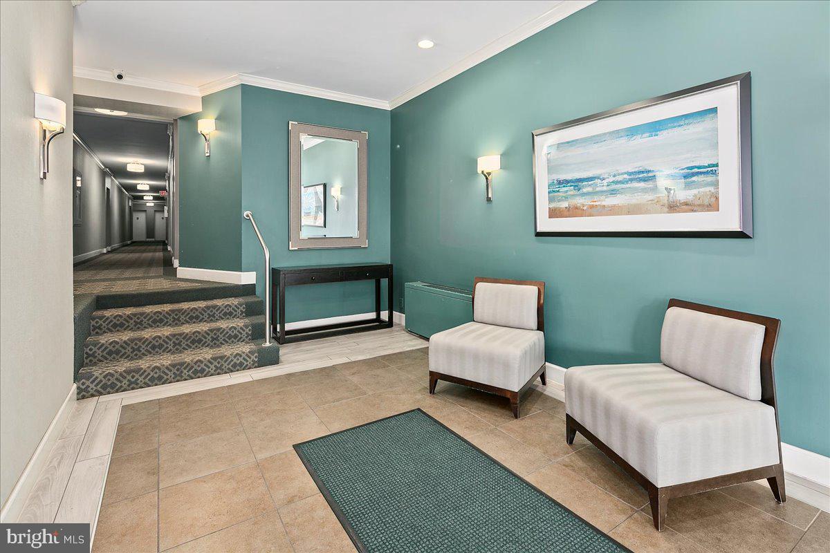 2016 North Adams Street, Unit 701 Arlington, VA 22201 - Photo 26 of 32 a bedroom with furniture and a lamp