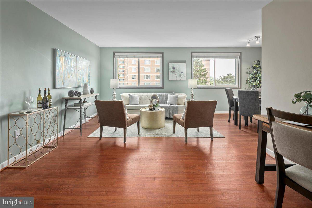2016 North Adams Street, Unit 701 Arlington, VA 22201 - Photo 3 of 32 a view of a dining room with furniture and wooden floor