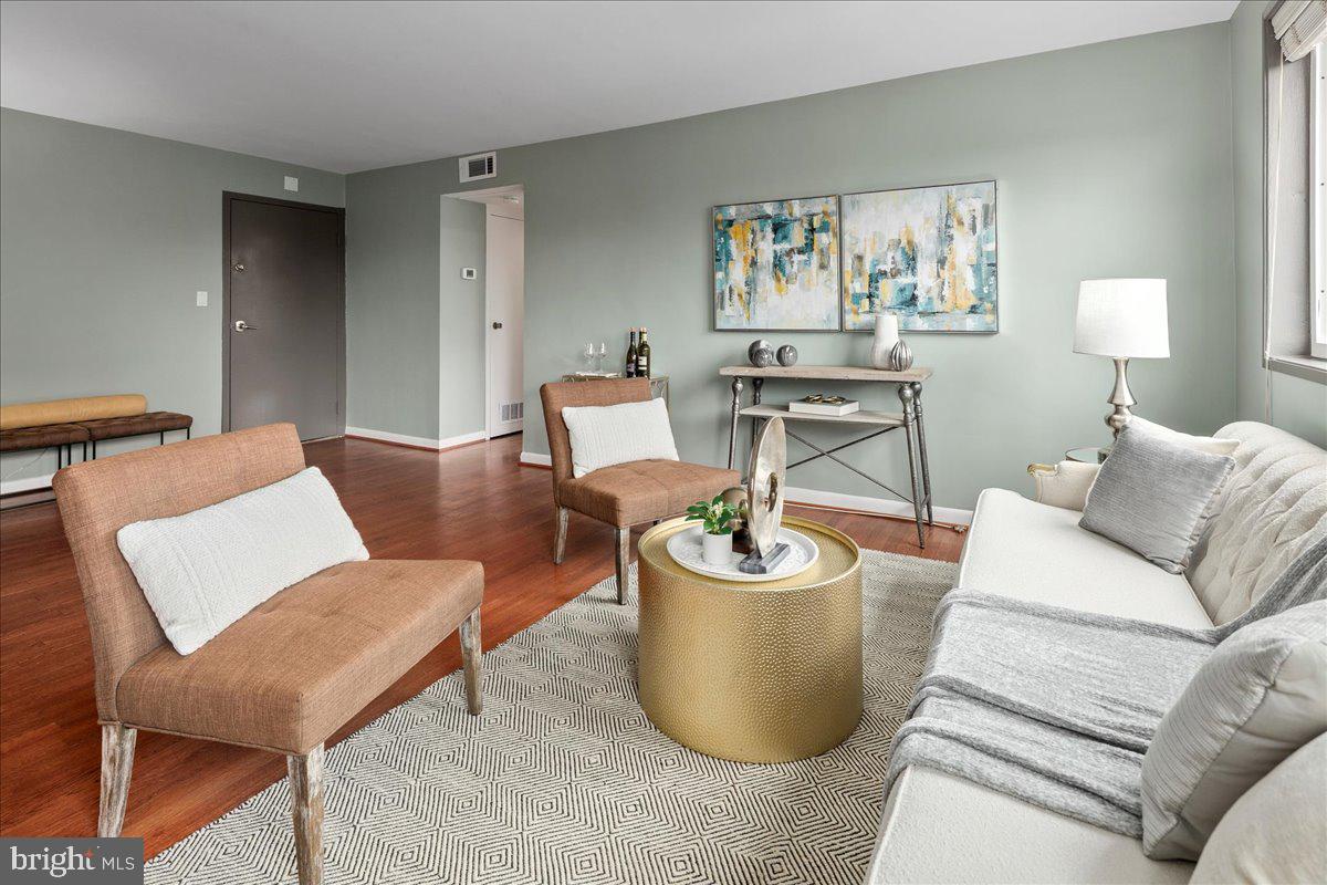 2016 North Adams Street, Unit 701 Arlington, VA 22201 - Photo 5 of 32 a living room with furniture a lamp paintings and a window