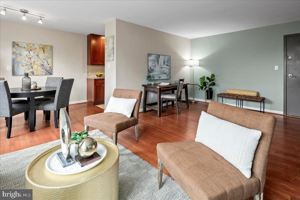 2016 North Adams Street, Unit 701 Arlington, VA 22201 - Photo 6 of 32 a living room with furniture kitchen view and a dining table