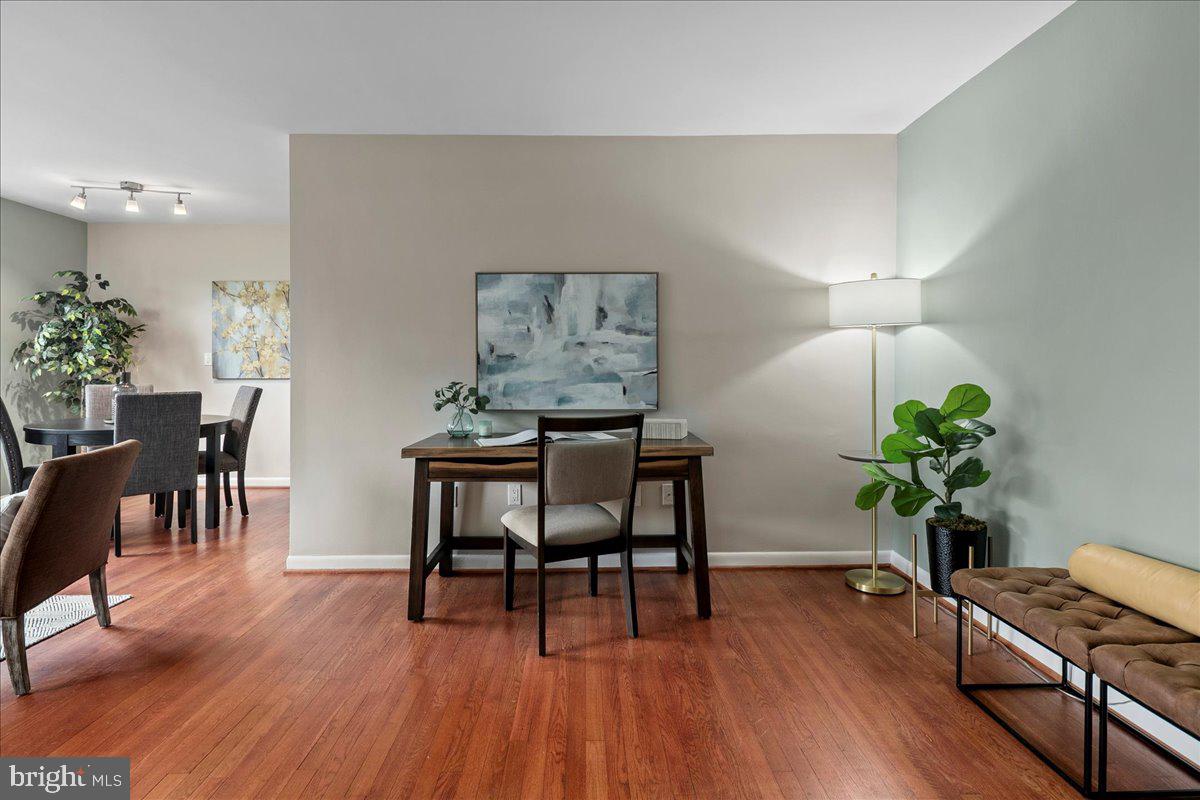 2016 North Adams Street, Unit 701 Arlington, VA 22201 - Photo 8 of 32 a view of a dining room with furniture and wooden floor