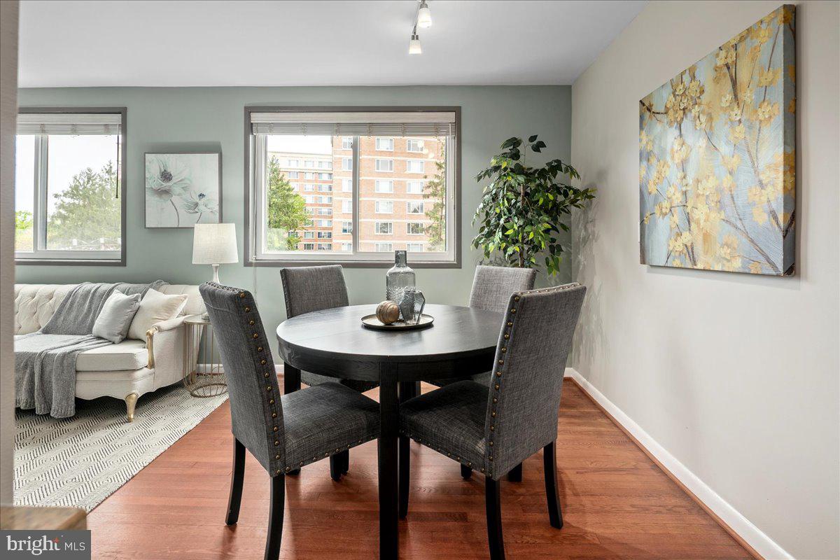 2016 North Adams Street, Unit 701 Arlington, VA 22201 - Photo 9 of 32 a view of a dining room with furniture and wooden floor