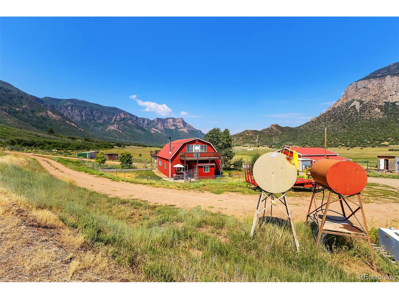 26101 16 16 1/10 Road Whitewater, CO 81527 - Photo 19 of 49 a view of a swimming pool with a table and chairs