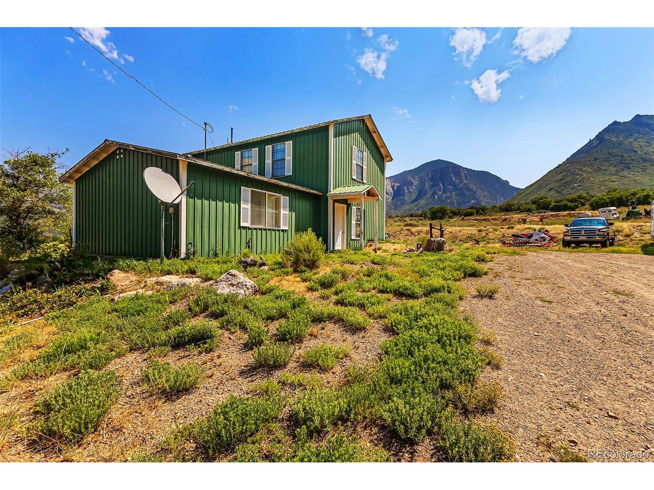 26101 16 16 1/10 Road Whitewater, CO 81527 - Photo 27 of 49 a front view of a house with a yard