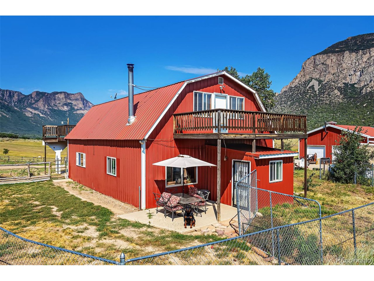 26101 16 16 1/10 Road Whitewater, CO 81527 - Photo 5 of 49 a front view of a house with a yard