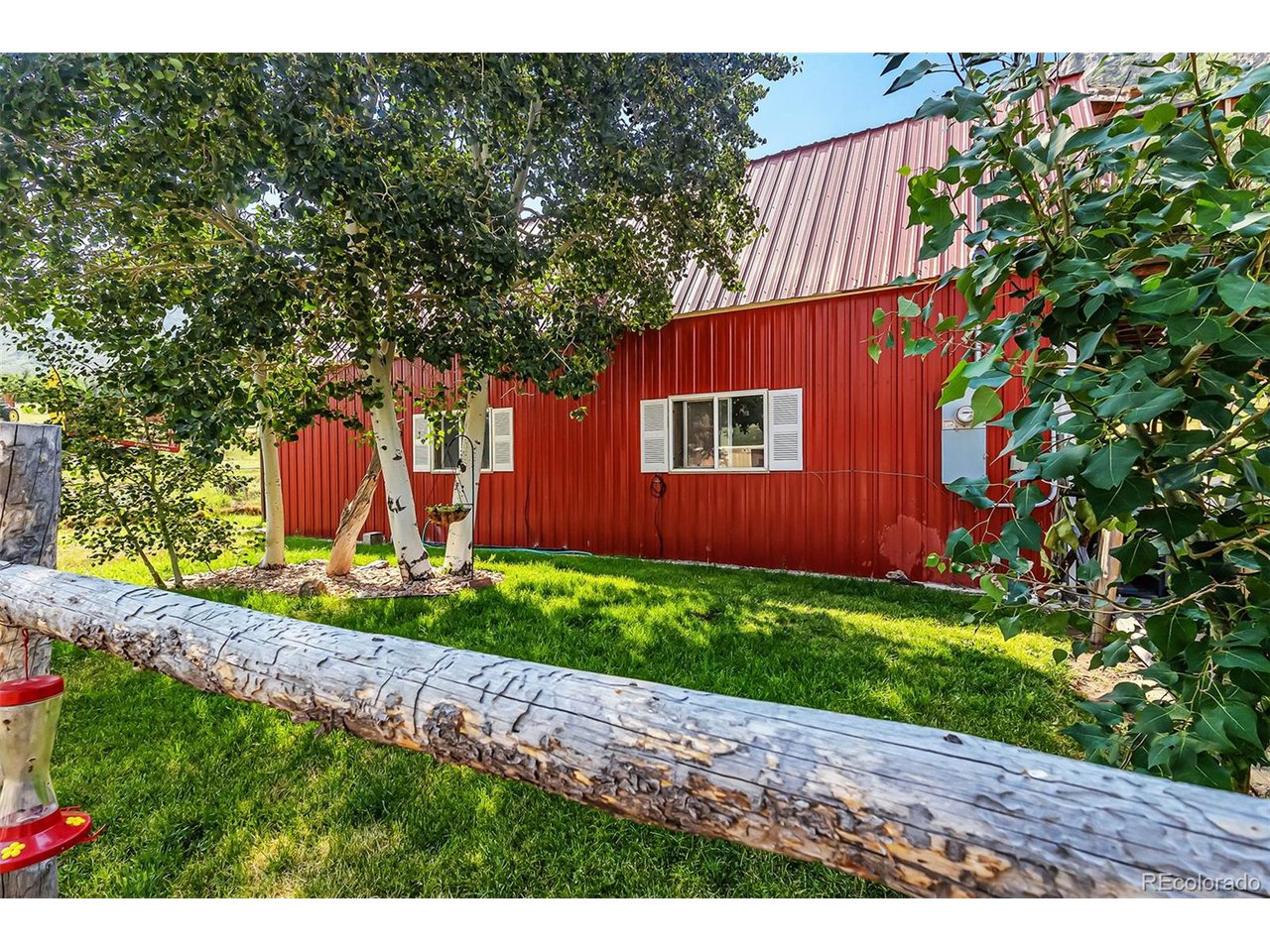 26101 16 16 1/10 Road Whitewater, CO 81527 - Photo 10 of 49 a view of a house with a backyard